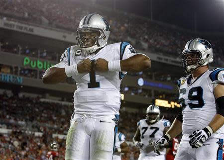 Oct 24, 2013; Tampa, FL, USA; Carolina Panthers quarterback Cam Newton (1) celebrates after he scored a touchdown during the second half against the Tampa Bay Buccaneers at Raymond James Stadium. Kim Klement-USA TODAY Sports