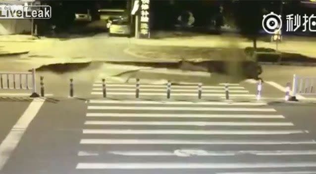 The sinkhole opening up was also caught on camera. Source: LiveLeak