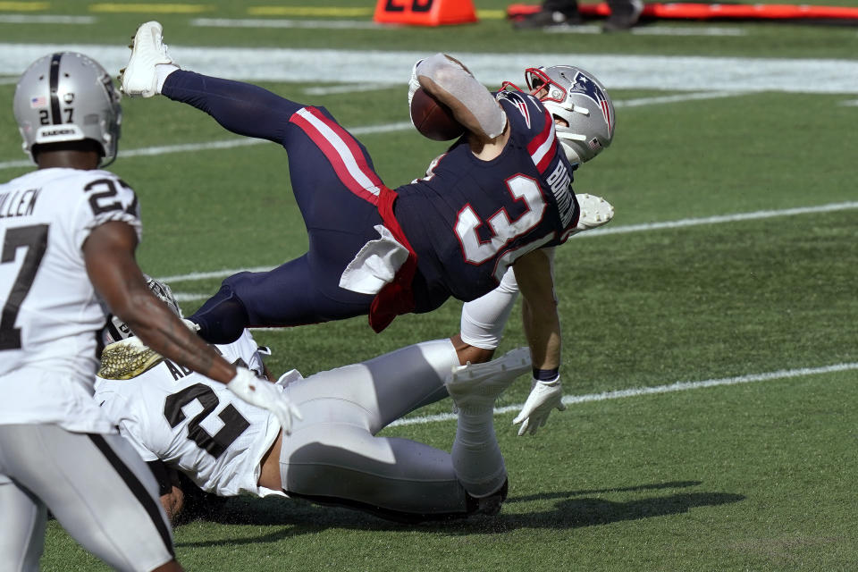 New England Patriots running back Rex Burkhead falls backward toward the end zone for a touchdown in the second half of an NFL football game against the Las Vegas Raiders, Sunday, Sept. 27, 2020, in Foxborough, Mass. (AP Photo/Steven Senne)