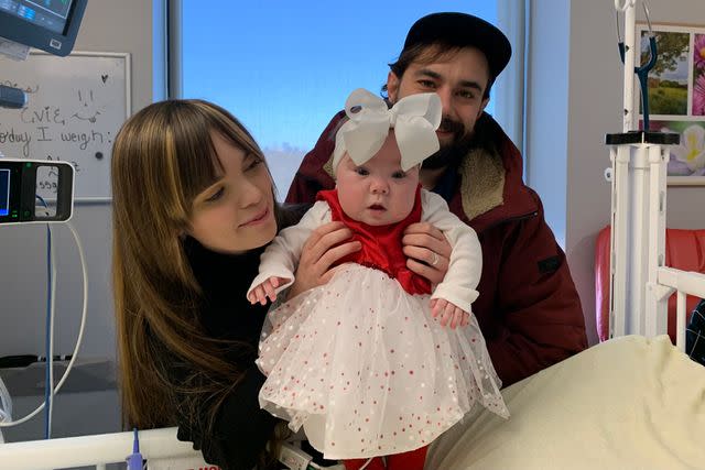 <p>BJC HealthCare</p> Madison Hickey (L) and Dylan Statler with their newborn daughter Evie