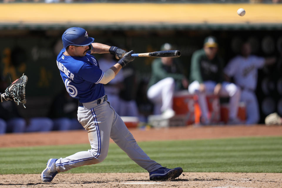 Toronto Blue Jays' Davis Schneider hits a home run against the Oakland Athletics during the eighth inning of a baseball game in Oakland, Calif., Wednesday, Sept. 6, 2023. (AP Photo/Jeff Chiu)