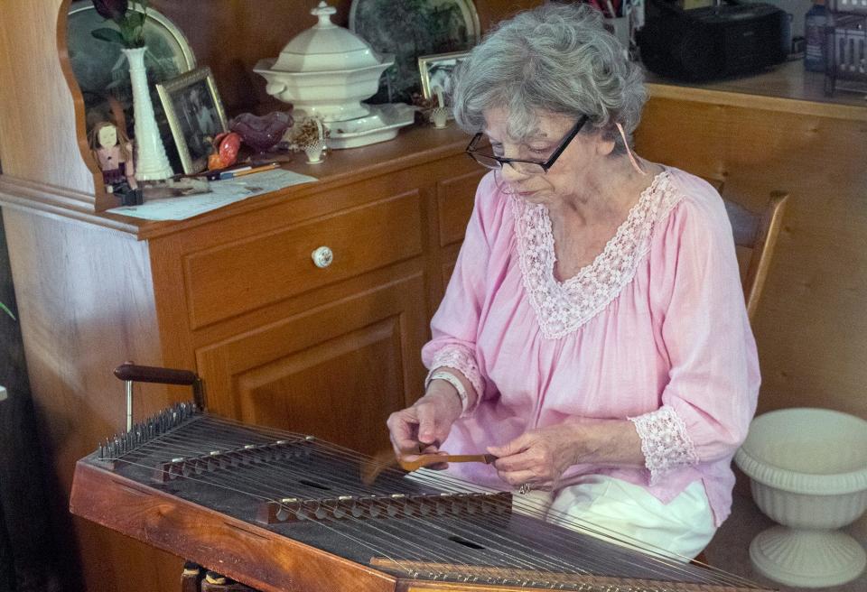 Jessica Eckard spends her free time with her 17-year-old Shi Zhu and playing a wide variety of instruments, like the dulcimer.