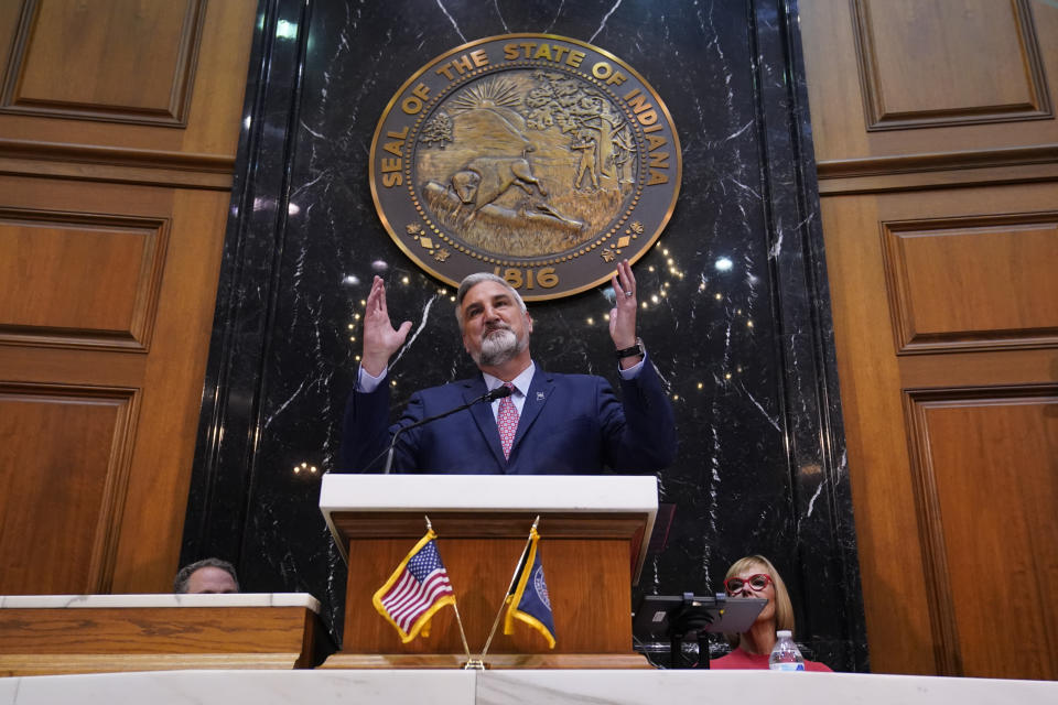 Indiana Gov. Eric Holcomb delivers his State of the State address to a joint session of the legislature at the Statehouse, Tuesday, Jan. 10, 2023, in Indianapolis. (AP Photo/Darron Cummings)