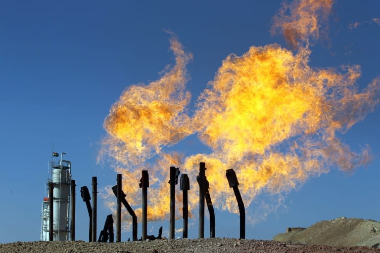 A gas flare burns off excess flammable gases at the Havana oil field retaken by Iraqi government forces on October 17, 2017