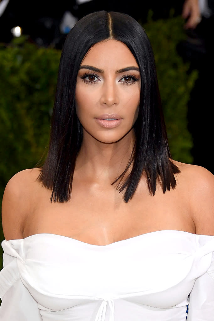 <p>For this year’s Met Gala, West gave off Cleopatra vibes while wearing a dark blunt bob cut and frosty highlighted eye makeup. (Photo: Venturelli/WireImage) </p>