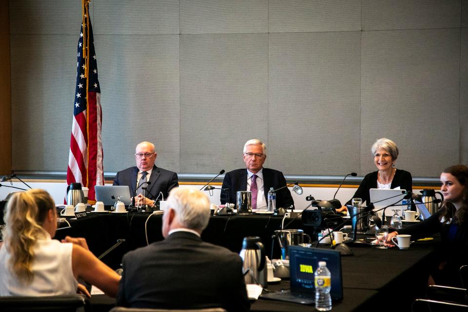 Mark Braun, executive director of the Iowa Board of Regents, left, president Mike Richards, center, and Sherry Bates, president pro tem, listen to a presentation during a meeting, Thursday, June 2, 2022, at the Levitt Center for University Advancement on the University of Iowa campus in Iowa City, Iowa.