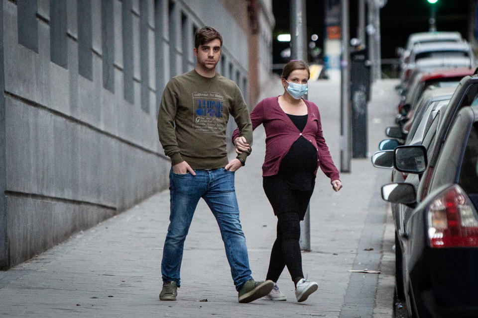 MADRID, SPAIN - MARCH 15: A pregnant woman wears face mask as the country works to stop the spread of the coronavirus on March 15, 2020 in Madrid, Spain. The cases in Madrid are reportedly at least 2,807 people infected of COVID-19 with at least 133 deaths. The Spanish government has declared a state of emergency and is poised to put the country under lockdown to combat the virus.  (Photo by Pablo Cuadra/Getty Images)