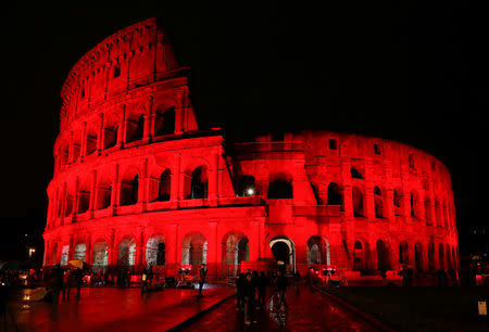 The Colosseum is lit up in red to draw attention to the persecution of Christians around the world in Rome, Italy, February 24, 2018. REUTERS/Remo Casilli