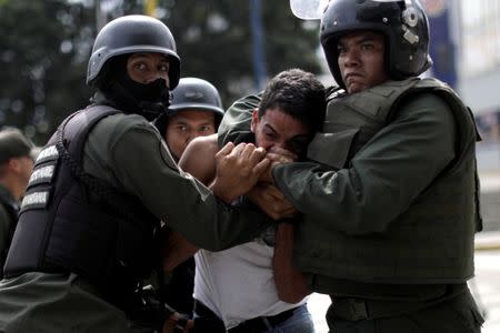 A demonstrator is detained at a rally during a strike called to protest against Venezuelan President Nicolas Maduro's government in Caracas, Venezuela, July 27, 2017 . REUTERS/Ueslei Marcelino