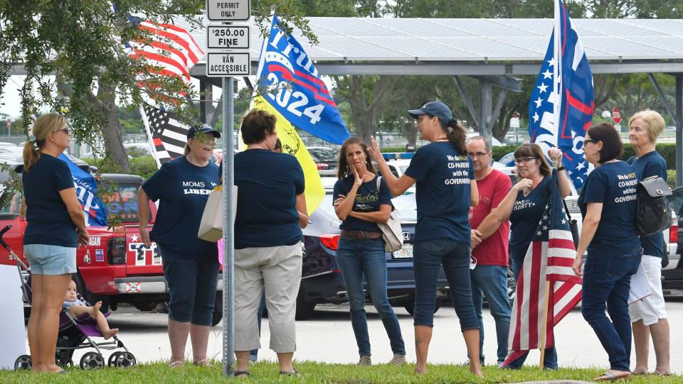 Moms for Liberty held a small prayer circle prior to a September 2021 school board meeting in Brevard. The mask mandate in public schools drew a peaceful protest before the meeting.