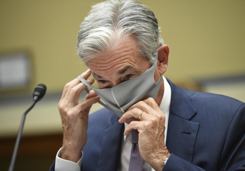 Federal Reserve Chair Jerome Powell takes off his face mask to testify during a House Select Subcommittee on the Coronavirus Crisis hearing on Capitol Hill in Washington on Wednesday, Sept. 23, 2020. (Kevin Dietsch/Pool via AP)