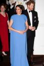 <p>The newest member of the British royal family looked stunning in a gown by Safiyaa that featured a subtle cape detail while on a royal tour visit to Fiji. <a href="https://www.townandcountrymag.com/style/fashion-trends/a24106614/meghan-markle-fijian-blue-gown-safiyaa-state-dinner-photos/" rel="nofollow noopener" target="_blank" data-ylk="slk:The vibrant Fijian blue color;elm:context_link;itc:0;sec:content-canvas" class="link ">The vibrant Fijian blue color</a> of the gown was a tribute to the country's flag.</p>