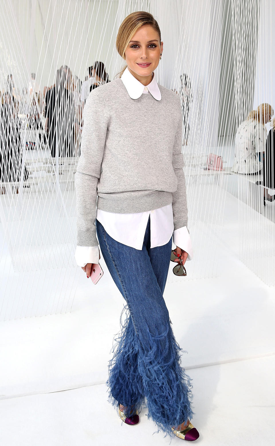 <p>Olivia Palermo's outfit is all buisness on top, feather denim party on the bottom.</p>