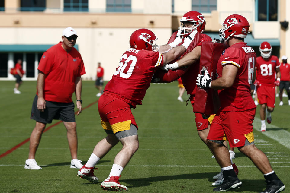 Kansas City Chiefs offensive guard Ryan Hunter (60) runs drills with offensive guards Nick Allegretti (73) and Stefen Wisniewski (61) during practice on Thursday, Jan. 30, 2020, in Davie, Fla., for the NFL Super Bowl 54 football game. (AP Photo/Brynn Anderson)