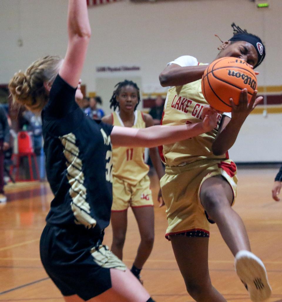 Lake Gibson's Taniya Brown drives for a layup as she is guarded by Viera's Lauren Brown on Saturday afternoon in the Dr. MLK Shootout at Lake Gibson High School.