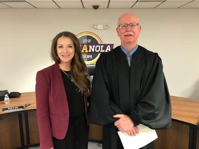 Stephanie Erickson, left, was sworn in by Iowa Fifth District Court Associate Judge Kevin Parker Dec. 20, 2021 as Indianola's mayor.