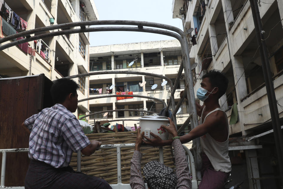 State railway employees load their belongings after being evicted from their home Saturday, March 20, 2021, in Mandalay, Myanmar. State railway workers in Mandalay have been threatened with eviction to force them to end their support for the Civil Disobedience Movement (CDM) against military rule. (AP Photo)