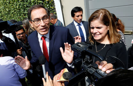 FILE PHOTO: Peruvian presidential candidate Pedro Pablo Kuczynski's running mates Martin Vizcarra (L) and Mercedes Araoz talk to the press outside his house in Lima, Peru, June 8, 2016. REUTERS/Mariana Bazo/File Photo