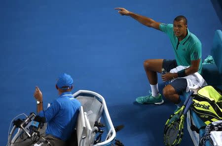 France's Jo-Wilfried Tsonga argues with umpire Fergus Murphy of Ireland during his fourth round match against Japan's Kei Nishikori at the Australian Open tennis tournament at Melbourne Park, Australia, January 24, 2016. REUTERS/Jason Reed