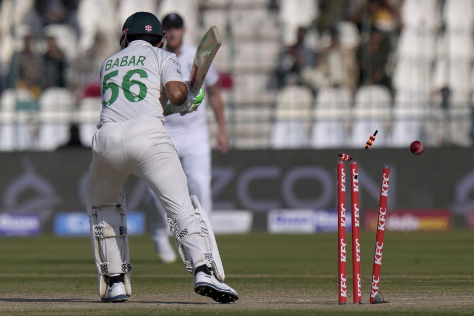 Pakistan's Babar Azam is bowled out by England's Ollie Robinson during the third day of the second test cricket match between Pakistan and England, in Multan, Pakistan, Sunday, Dec. 11, 2022. (AP Photo/Anjum Naveed)