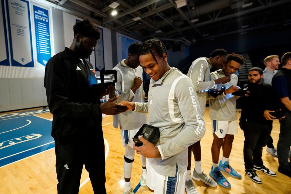The Saint Peter's men's basketball team is honored during a pregame ceremony at Yanitelli Center on Monday, Nov. 7, 2022, in Jersey City. The Peacocks became the first No. 15 seed to make it to the Elite Eight in the 2022 NCAA Tournament.