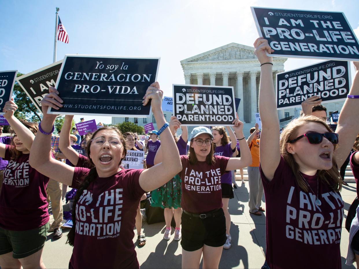 Anti-abortion protesters outside the US Supreme Court (AP)
