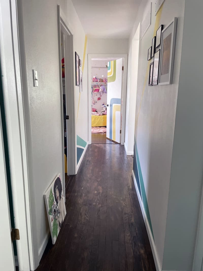 white hallway looking into kids room