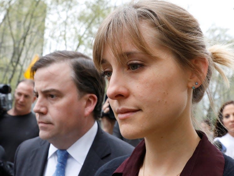 Actor Allison Mack, known for her role in the TV series 'Smallville', exits with her lawyer following a hearing on charges of sex trafficking in relation to the Albany-based organization Nxivm at United States Federal Courthouse in Brooklyn, New York, U.S., May 4, 2018. REUTERS/Brendan McDermid