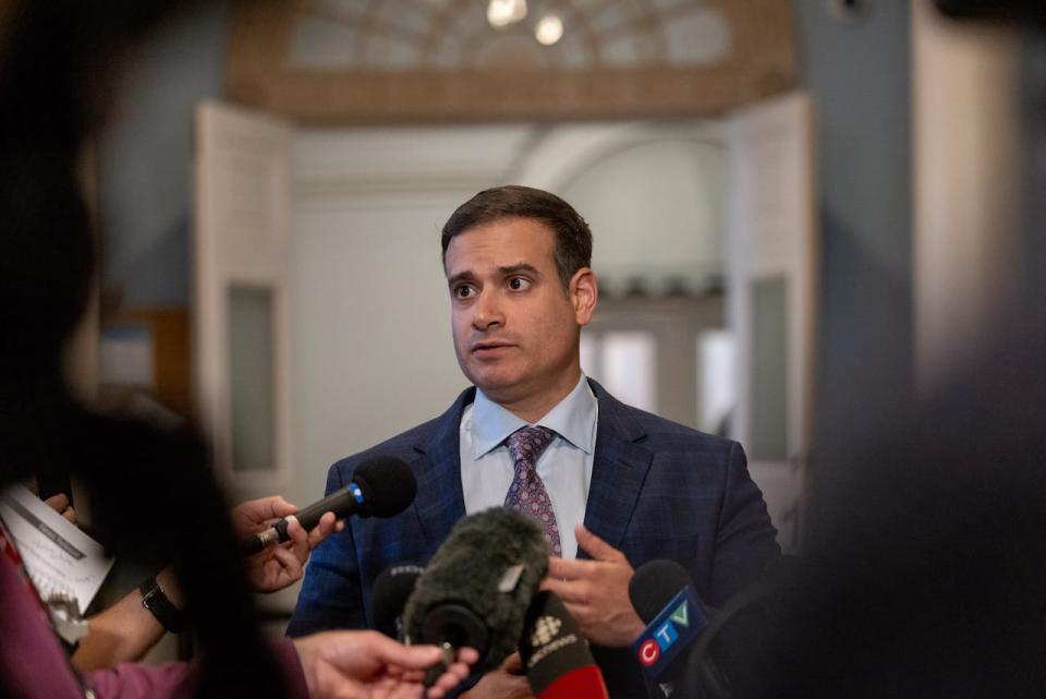 Liberal Leader Zach Churchill speaks to reporters at Province House.