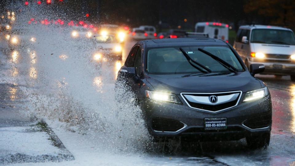 <div>Cars drive through a puddle of frothy water in the University District as high winds and rain tear through the Seattle area Monday, Nov. 13, 2017.</div> <strong>(Genna Martin/San Francisco Chronicle via Getty Images)</strong>