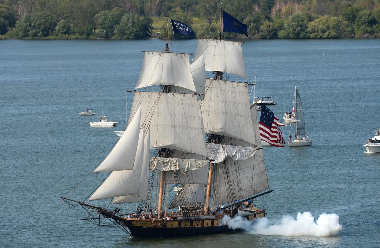 The U.S. Brig Niagara fires its cannon during the Tall Ships Erie festival's Parade of Sail on Aug. 22, 2019.