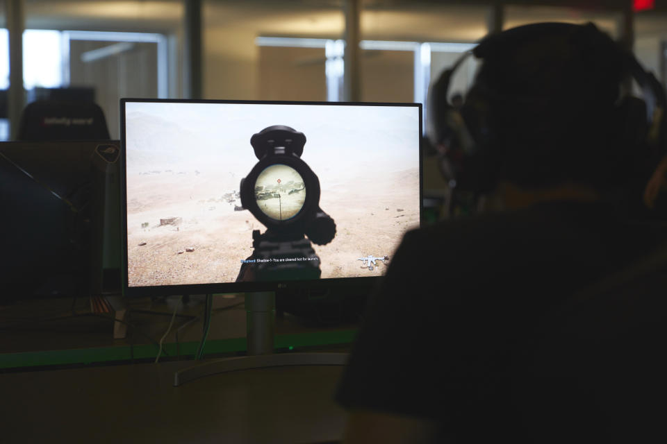 An employee tests a version of Call of Duty on Friday, Oct. 21, 2022, at Activision Blizzard, Infinity Ward Division, in Woodland Hills, Calif. Call of Duty has been one of the best-selling video games for the past decade-plus, and is at the heart of the developing antitrust fight over whether Microsoft will be able to acquire Activision Blizzard. (AP Photo/Allison Dinner)