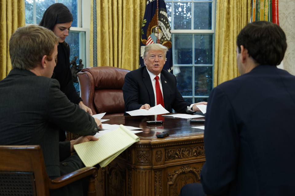 President Donald Trump speaks during an interview with The Associated Press in the Oval Office of the White House, Tuesday, Oct. 16, 2018, in Washington. (AP Photo/Evan Vucci)