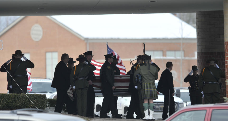 FILE - In this Dec. 22, 2010, file photo, law enforcement officers carry the casket of Border Patrol officer and former U.S. Marine Brian Terry out of Greater Grace Temple after his funeral service in Detroit. A man extradited to the U.S. from Mexico has pleaded not guilty to charges of pulling the trigger in Terry's slaying. Court records show Heraclio Osorio-Arellanes entered his plea during a Wednesday, Aug. 1, 2018, arraignment in U.S. District Court in Tucson, Ariz. (John T. Greilick/Detroit News via AP, File)