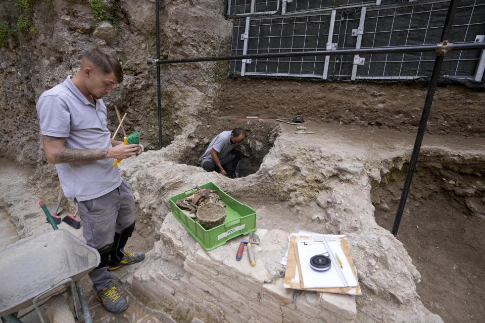 Archeologists work in excavation site of the ancient Roman emperor Nero's theater, 1st century AD, during a press preview, in Rome, Wednesday, July 26, 2023. The ruins of Nero's Theater, an imperial theater referred to ancient Roman texts but never found, have been discovered under the garden of the future Four Season's Hotel, steps from the Vatican, after excavating the walled garden of the Palazzo della Rovere since 2020, as part of planned renovations on the Renaissance building. (AP Photo/Andrew Medichini)