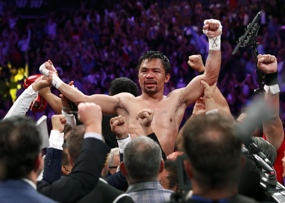 FILE PHOTO:  Manny Pacquiao celebrates his split decision victory over Keith Thurman in their WBA welterweight title fight at MGM Grand Garden Arena on July 20, 2019 in Las Vegas, Nevada.  (Photo by Steve Marcus/Getty Images)