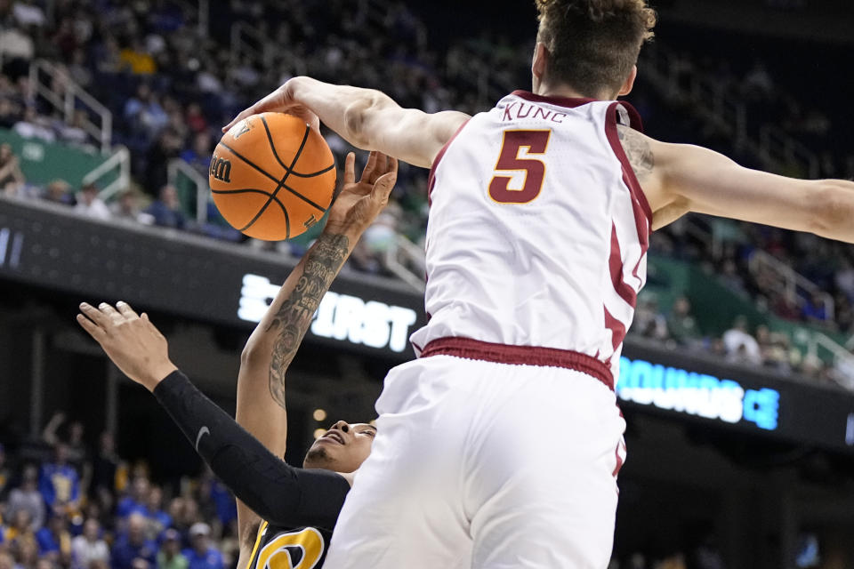 Iowa State forward Aljaz Kunc blocks a shot by Pittsburgh guard Greg Elliott during the first half of a first-round college basketball game in the NCAA Tournament on Friday, March 17, 2023, in Greensboro, N.C. (AP Photo/Chris Carlson)