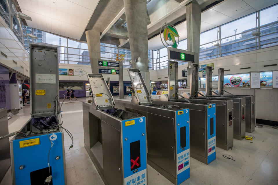 Vandalized turnstiles stand inside Tung Chung station, operated by MTR Corp,. during a protest in Hong Kong, China, on Sunday, Sept. 1, 2019. | Paul Yeung/Bloomberg via Getty Images