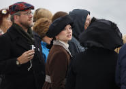 Passengers, including Amy Marie Beechler, center, from Buffalo, NY, in period costume, watch as the MS Balmoral Titanic memorial cruise ship, arrives at New York port, Thursday, April 19, 2012. Exactly 100 years after the Titanic went down, the cruise retraced the ship's voyage, departing from Southampton, England, included a visit Sunday, April 15, to the location where it sank, then a stop in Halifax, Canada and final destination at New York, as of the original intended trip. (AP Photo/Lefteris Pitarakis)