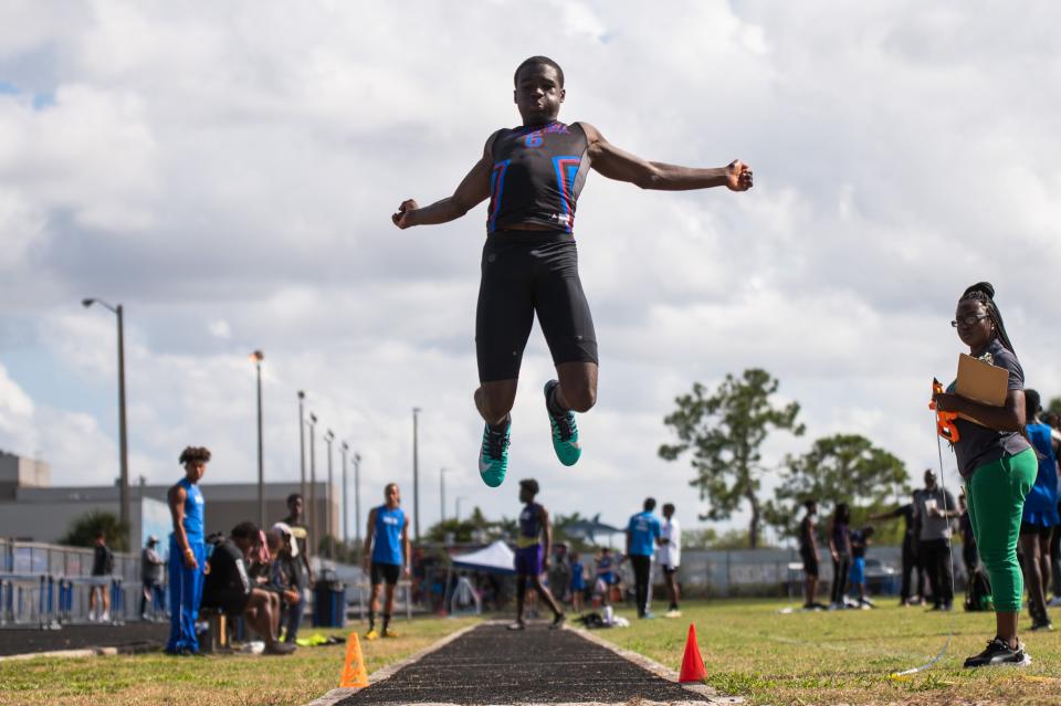 Hardley Gilmore, Pahokee, leaps in the long jump during the Palm Beach County Track and Field Championships at Spanish River High School on Thursday, April 6, 2023, in Boca Raton, Fla.