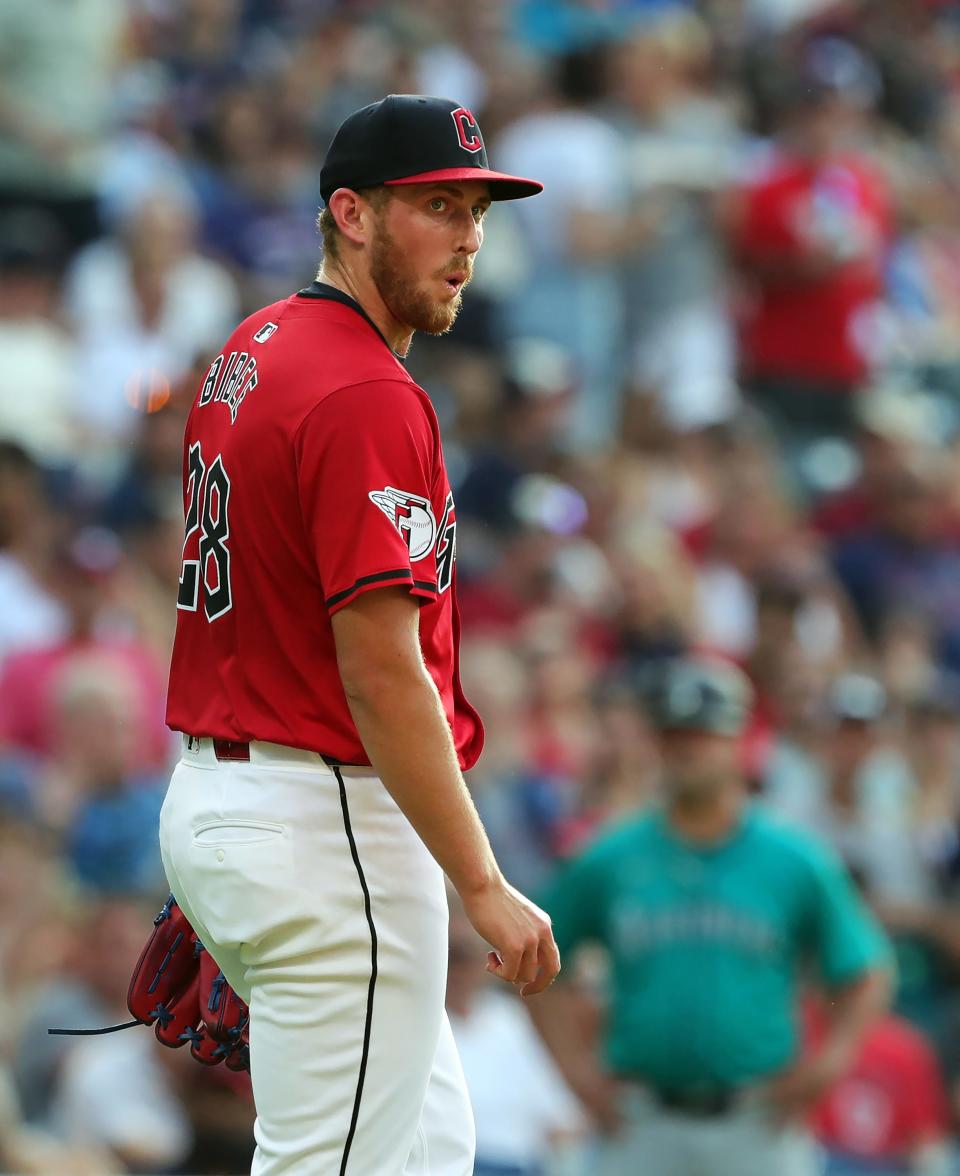 Cleveland Guardians starting pitcher Tanner Bibee (28) reacts after a strike was initially called a ball during the second inning of an MLB game against the Seattle Mariners at Progressive Field, Wednesday, June 19, 2024, in Cleveland, Ohio.