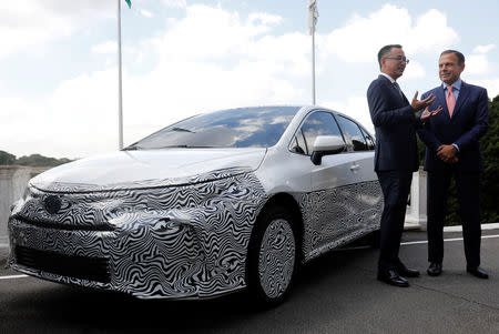 President of Toyota in Brazil, Rafael Chang, gestures next to the governor of Brazil's Sao Paulo state Joao Doria, as he announces a Brazilian vehicle which is equipped with the hybrid technology during a news conference in Sao Paulo, Brazil, April 17, 2019. REUTERS/Nacho Doce