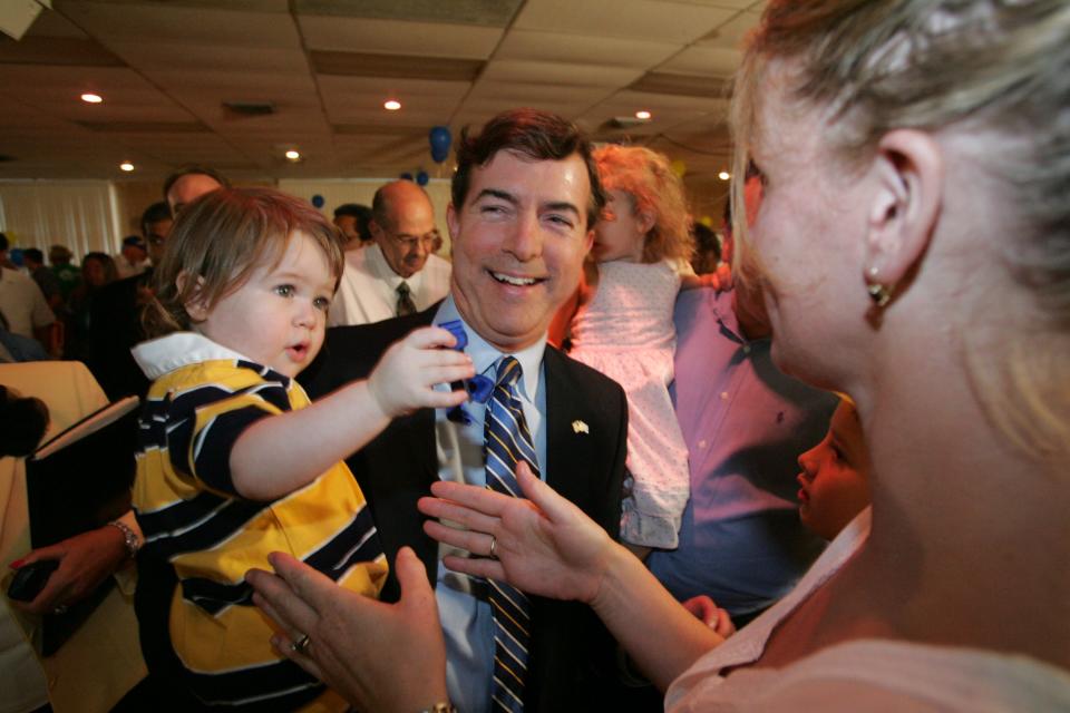 Steve Laffey, holding his daughter Audrey, 21 months old, greets supporters at the VFW hall in Cranston after announcing his intention to run for the U.S. Senate on Sept. 9, 2005. He took on incumbent Sen. Lincoln D. Chafee and lost.