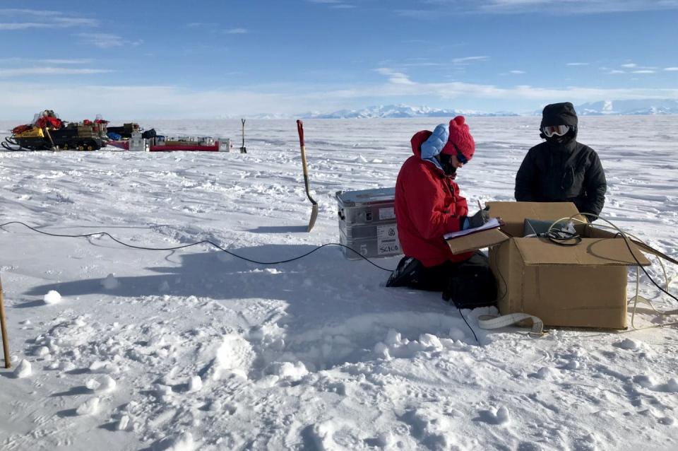 <span class="caption">Co-author Chloe Gustafson and mountaineer Meghan Seifert install measuring equipment on an ice stream.</span> <span class="attribution"><a class="link " href="https://emlab.ldeo.columbia.edu/index.php/projects/subglacial-em-mapping/" rel="nofollow noopener" target="_blank" data-ylk="slk:Kerry Key/Lamont-Doherty Earth Observatory">Kerry Key/Lamont-Doherty Earth Observatory</a></span>