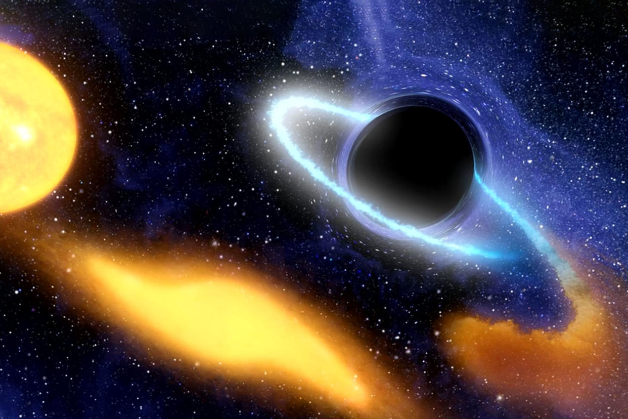 An illustration of a supermassive black hole at the center of a galaxy NASA/JPL-Caltech