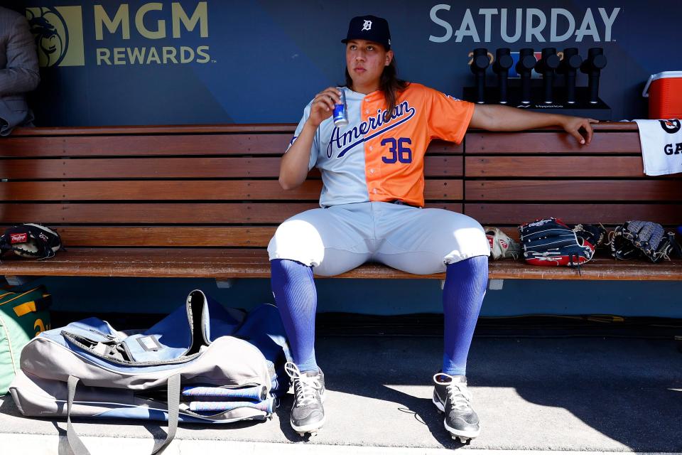 Detroit Tigers prospect Wilmer Flores of the American League sits in the dugout before the SiriusXM All-Star Futures Game on Saturday, July 16, 2022 at Dodger Stadium in Los Angeles.