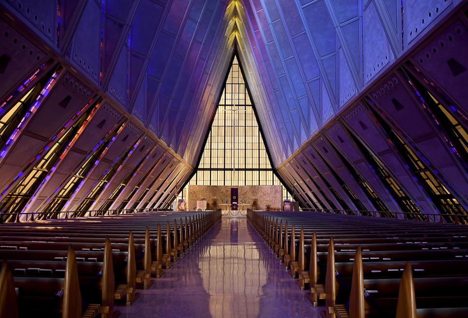 In this April 12, 2017, photo, light shines through the stained glass at the Cadet Chapel at the U.S. Air Force Academy outside Colorado Springs, Colo. The landmark Cadet Chapel is suffering from leaks and corrosion, so the school has drawn up the most ambitious restoration project in the building’s 55-year history. (AP Photo/Thomas Peipert)