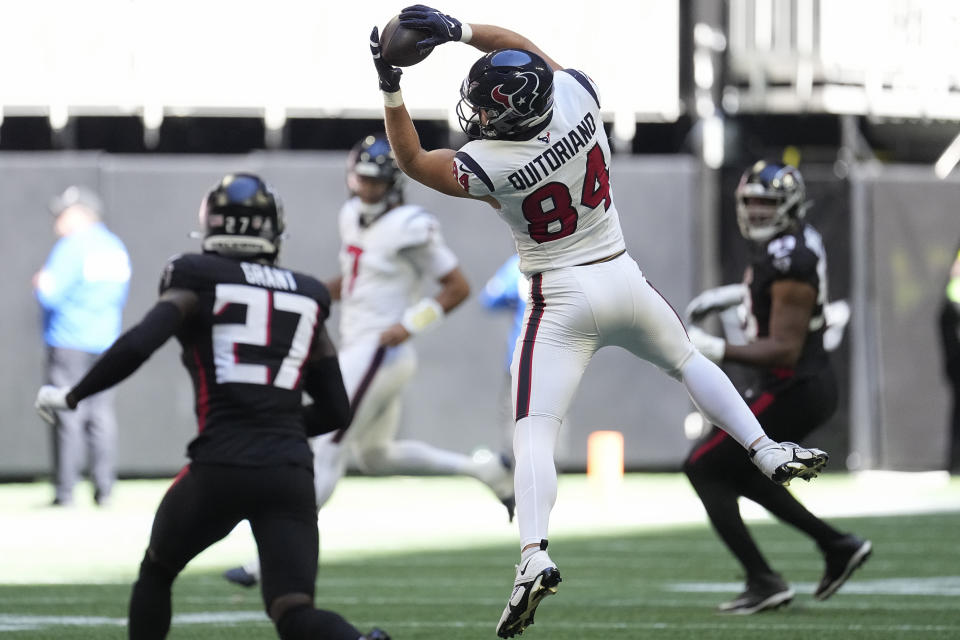 Houston Texans tight end Teagan Quitoriano (84) catches the ball in the first half of an NFL football game against the Atlanta Falcons in Atlanta, Sunday, Oct. 8, 2023. (AP Photo/John Bazemore)