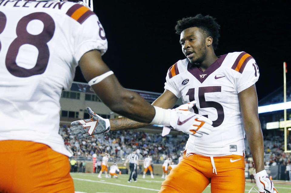 The first punt return of the season Virginia Tech’s Sean Savoy (15) did not go well. (AP Photo/Michael Dwyer)