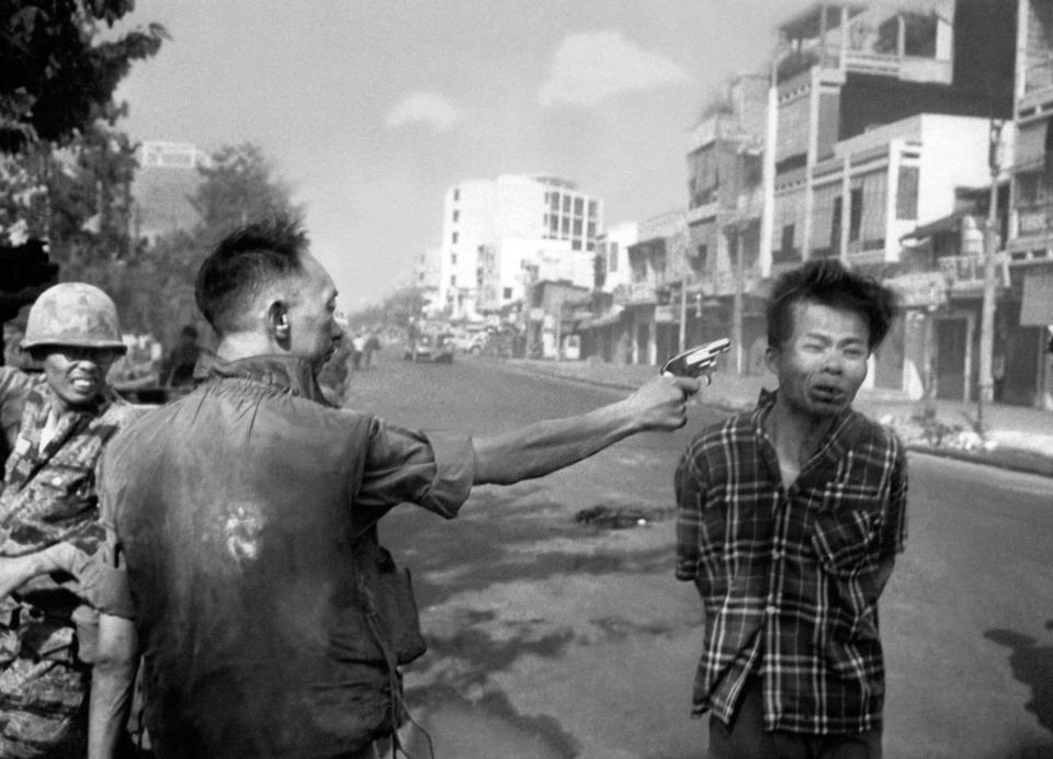 FILE - South Vietnamese National Police Chief Brig Gen. Nguyen Ngoc Loan executes a suspected Viet Cong officer with a single pistol shot in the head in Saigon, Vietnam, Feb. 1, 1968. The Viet Cong guerrilla was captured near Quang Pagoda carrying a pistol and wearing civilian clothes. He was identified as an officer and taken to the police chief. (AP Photo/Eddie Adams, File)